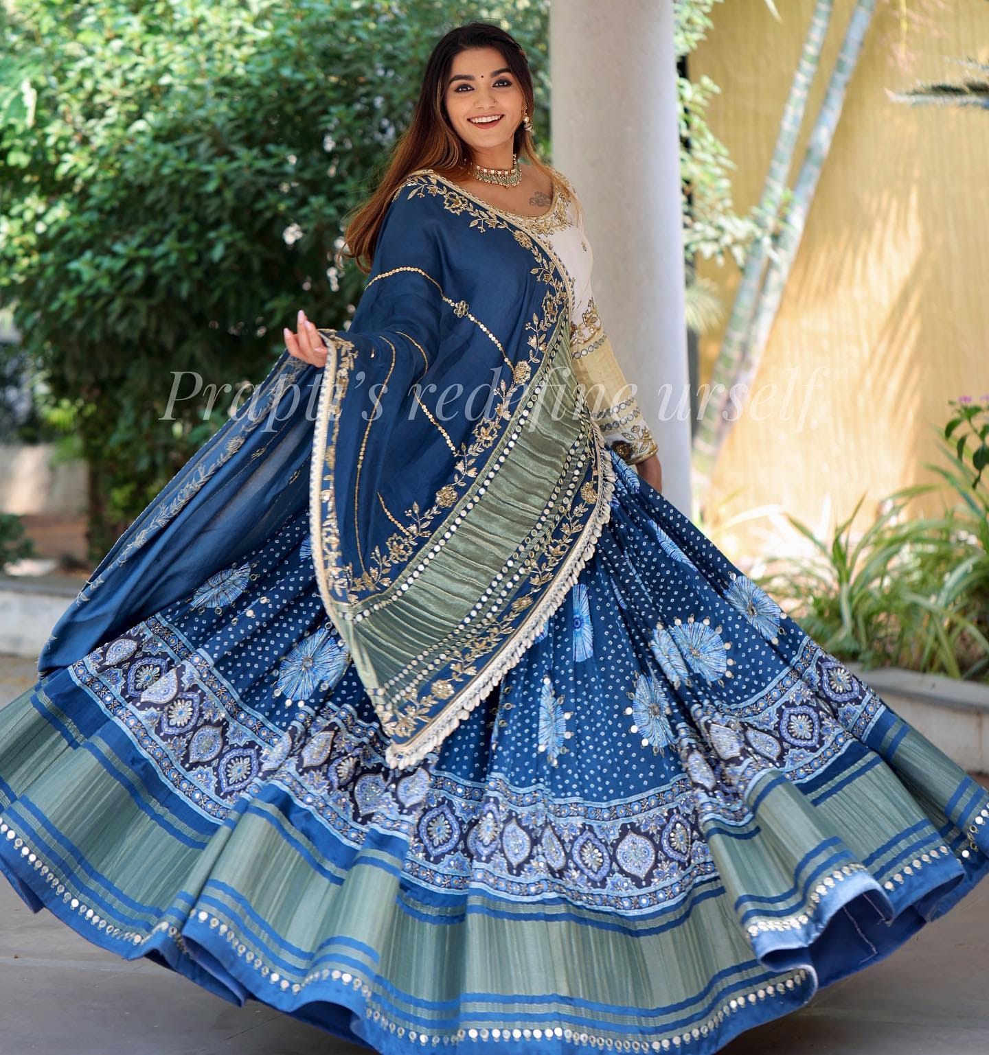 blue Lehenga Choli with Mirror work and attached Rama Dupatta