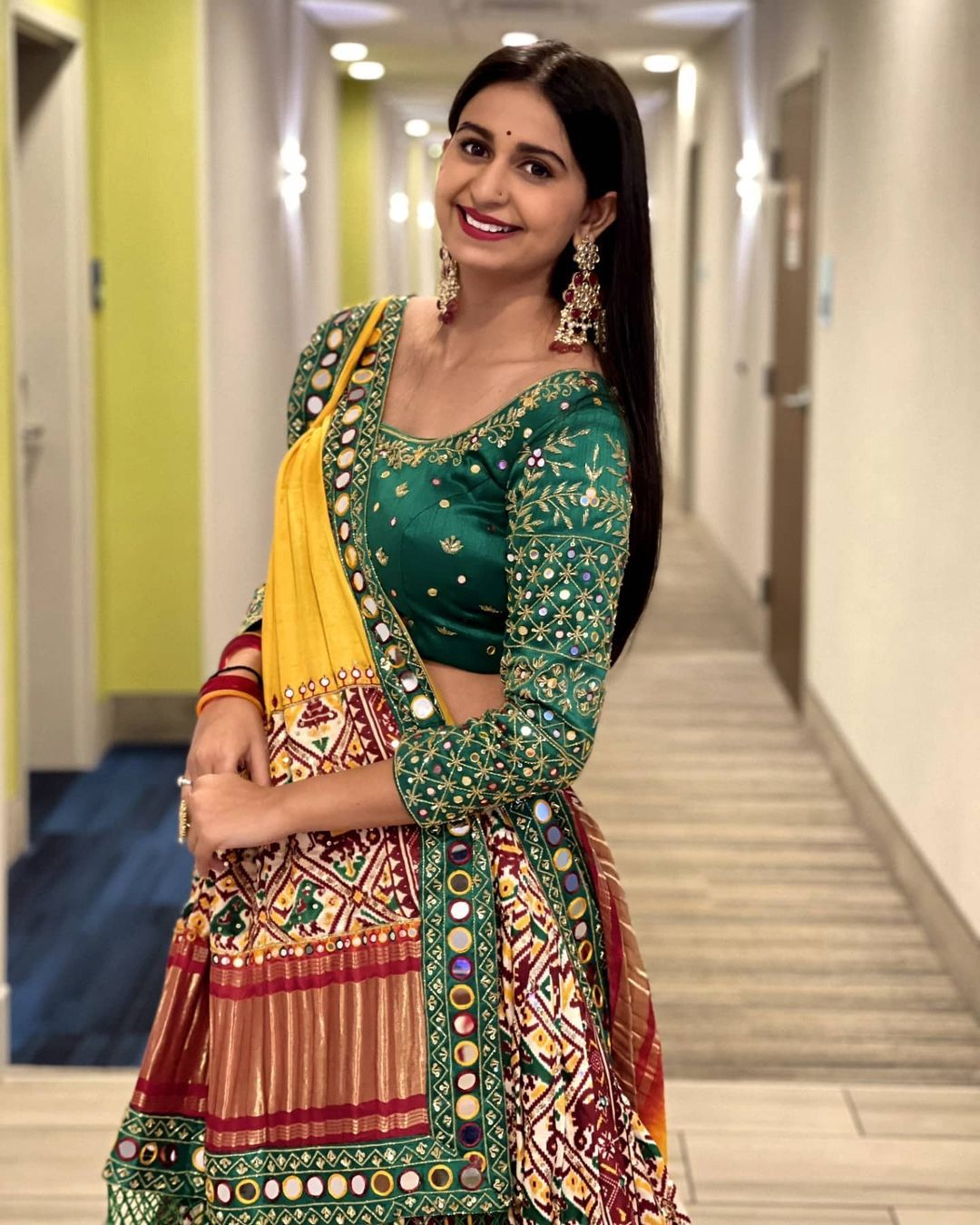 Red Green Lehenga Choli with Mirror work and attached Yellow Dupatta