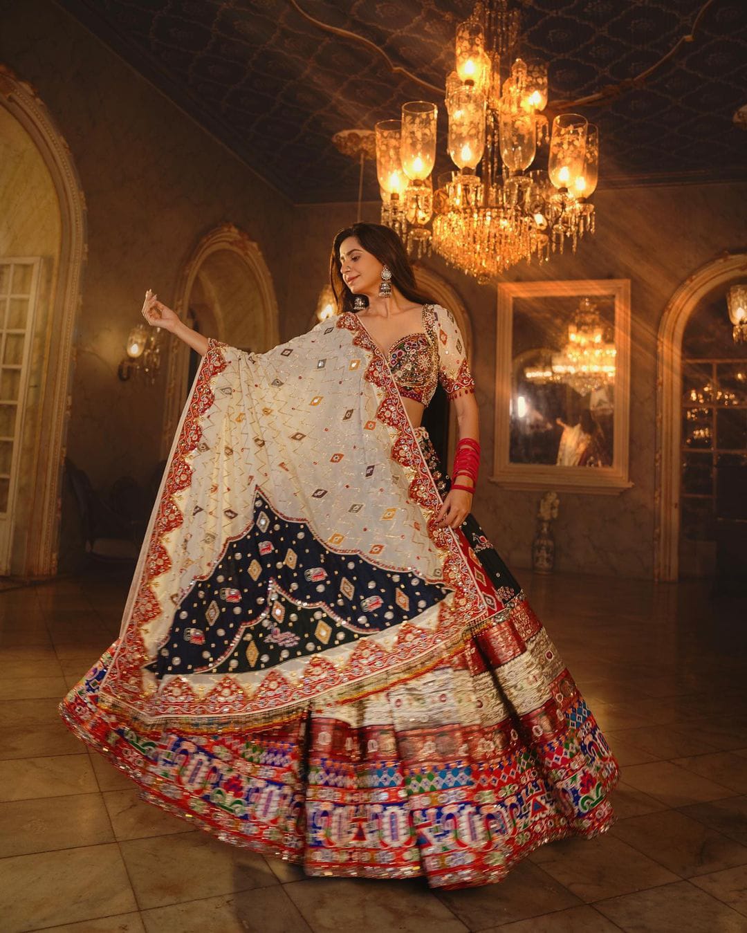 Multi Colour Lehenga Choli with Mirror work and attached Pink Dupatta