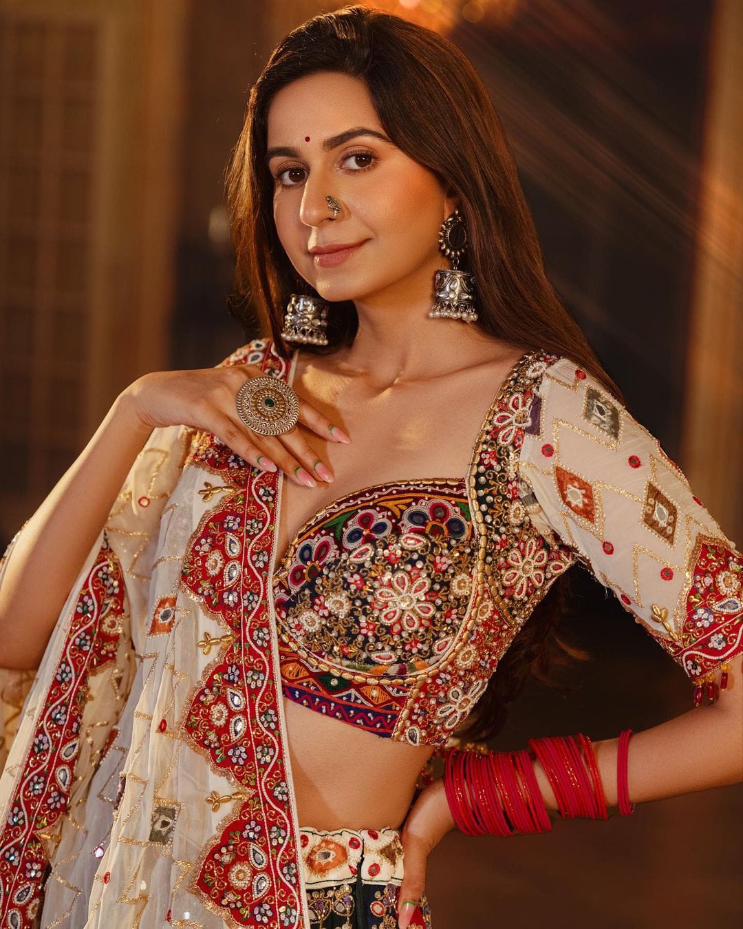 Multi Colour Lehenga Choli with Mirror work and attached Pink Dupatta